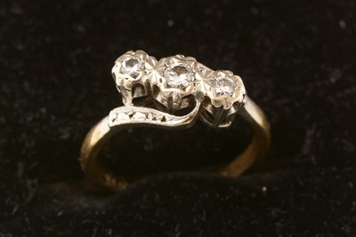Lot 162 - A three stone diamond ring