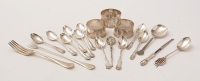 Lot 185 - A selection of silver napkin rings, teaspoons and other items