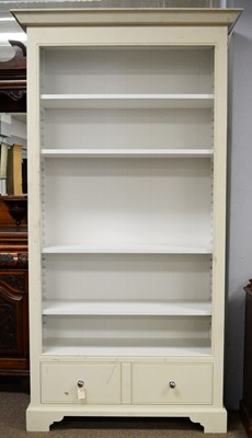Lot 54A - A cream painted open bookcase.