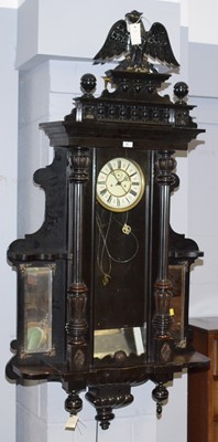 Lot 55 - A Vienna style ebonised wall clock.
