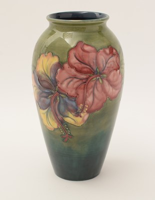 Lot 411 - Moorcroft Hibiscus pattern vase.