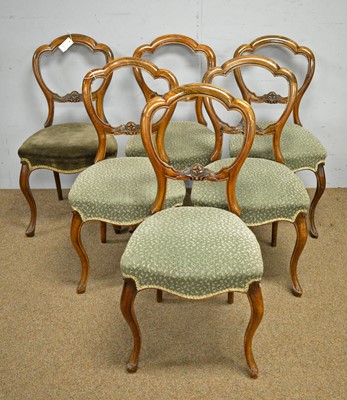 Lot 17 - A set of six Victorian walnut balloon back chairs.