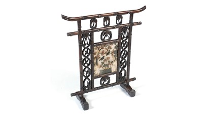 Lot 1256 - A Chinese carved hardwood firescreen, c1900.