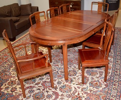 Lot 77 - A modern Chinese hardwood ten-piece dining room suite.