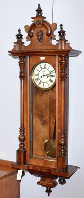 Lot 73 - A walnut Vienna-style clock.