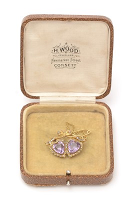 Lot 422 - An Edwardian amethyst and seed pearl brooch