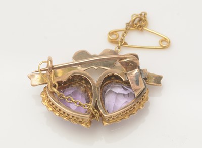Lot 422 - An Edwardian amethyst and seed pearl brooch