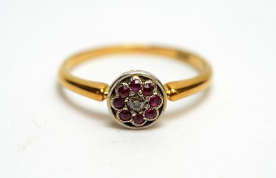Lot 130 - An Edwardian ruby and diamond cluster ring