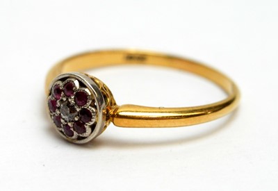 Lot 130 - An Edwardian ruby and diamond cluster ring