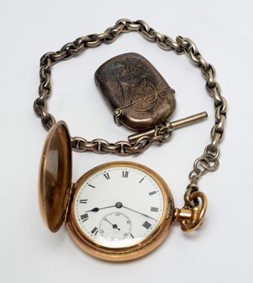 Lot 124 - A hunter gilt cased pocket watch, on silver watch chain with vesta case.