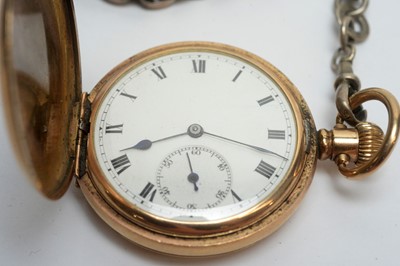 Lot 124 - A hunter gilt cased pocket watch, on silver watch chain with vesta case.