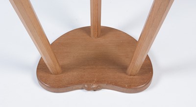 Lot 1275 - Workshop of Robert ‘Mouseman’ Thompson (Kilburn): an oak cow stool.