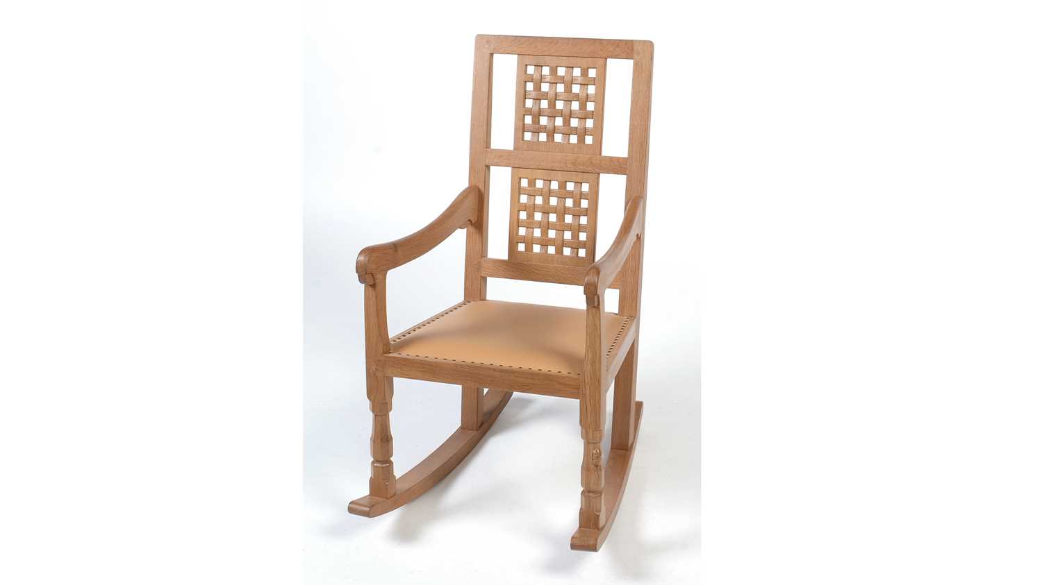 Lot 1279 - Workshop of Robert 'Mouseman' Thompson (Kilburn): oak rocking chair.