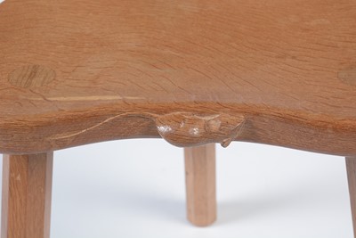 Lot 1283 - Workshop of Robert ‘Mouseman’ Thompson (Kilburn): an oak cow stool.