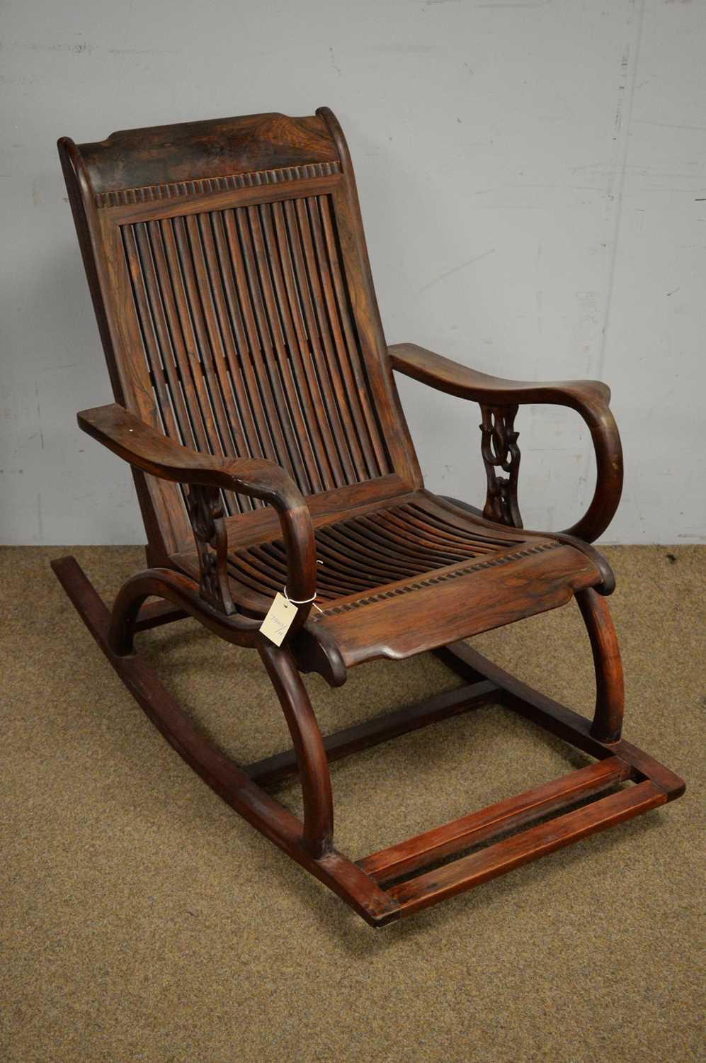 Lot 44 - A Chinese hardwood rocking chair
