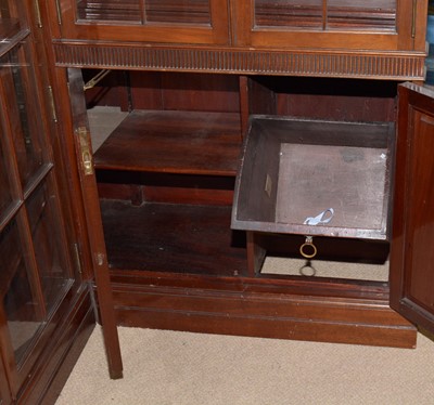 Lot 78 - A Victorian-style mahogany two-piece corner bookcase.