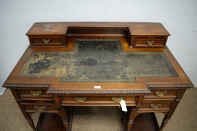 Lot 16 - A late Victorian mahogany kneehole writing desk in the manner of Maple & Co
