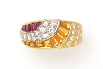 Lot 430 - A ruby, yellow-sapphire and diamond dress ring