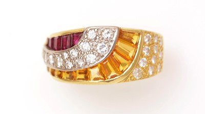 Lot 430 - A ruby, yellow-sapphire and diamond dress ring