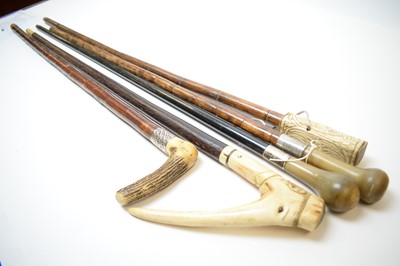Lot 397 - Two silver collared horn handled walking sticks and three others.