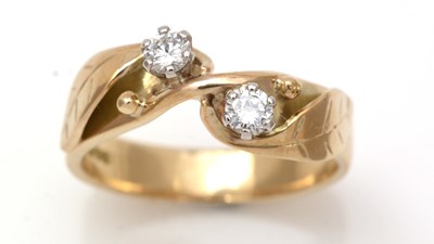 Lot 199 - A two stone diamond ring