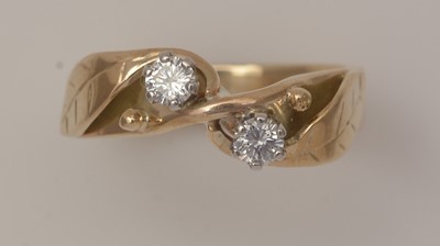 Lot 435 - A two stone diamond ring