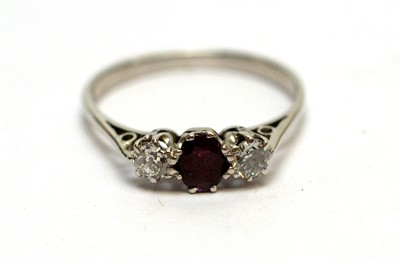 Lot 166 - A diamond and ruby three-stone ring