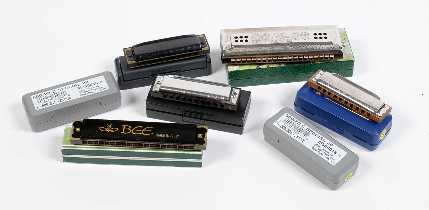 Lot 14 - seven Harmonicas