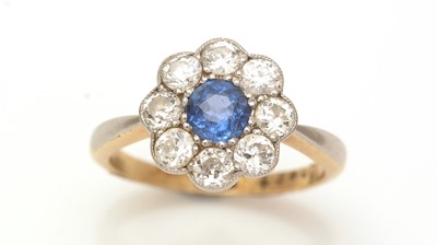 Lot 443 - A sapphire and diamond cluster ring