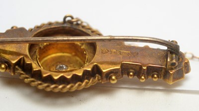 Lot 113 - An Edwardian 9ct yellow gold and diamond brooch