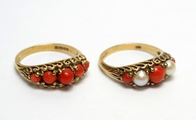 Lot 165 - Two coral set rings.
