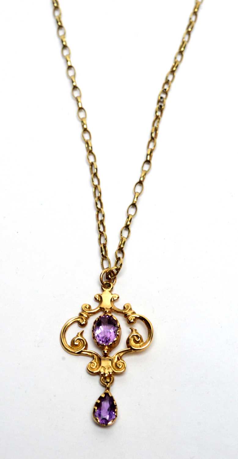 Lot 169 - A 9ct yellow gold and amethyst set Edwardian style pendant