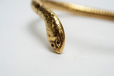 Lot 164 - A 9ct yellow gold snake pattern bangle