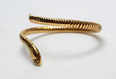 Lot 164 - A 9ct yellow gold snake pattern bangle
