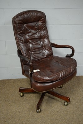 Lot 56 - A Victorian style buttoned leather swivel and reclining desk chair