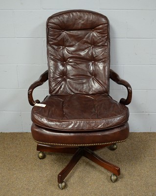 Lot 56 - A Victorian style buttoned leather swivel and reclining desk chair