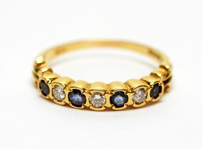 Lot 185 - A sapphire and diamond half hoop eternity ring