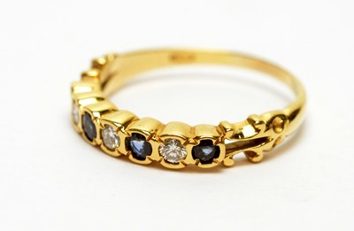 Lot 185 - A sapphire and diamond half hoop eternity ring