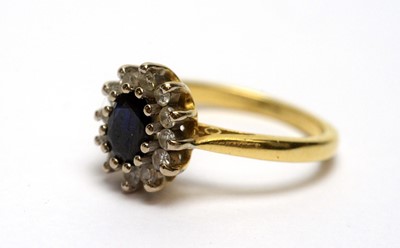 Lot 178 - A sapphire and diamond cluster ring