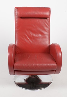 Lot 328 - A contemporary red leather swivel reclining armchair
