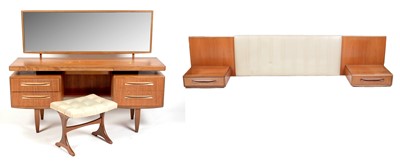 Lot 304 - Victor B Wilkins for G Plan: a mid Century teak 'Fresco' dressing table, stool and headboard