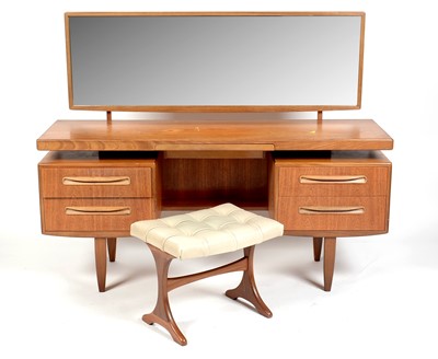 Lot 304 - Victor B Wilkins for G Plan: a mid Century teak 'Fresco' dressing table, stool and headboard