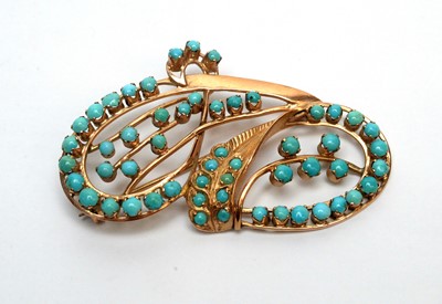 Lot 102 - A turquoise and gold brooch