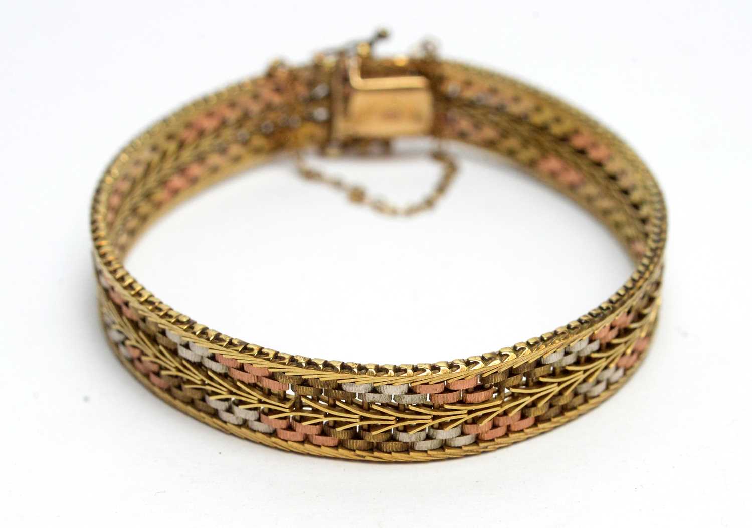 Lot 144 - A 9ct yellow, rose and white gold bracelet