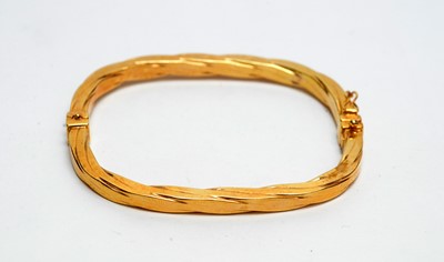 Lot 145 - A 9ct yellow gold bangle