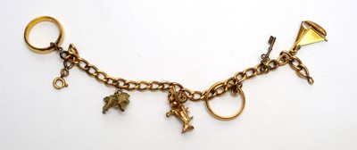 Lot 148 - A gold curb link charm bracelet