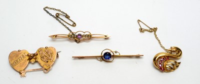 Lot 149 - Four gold brooches