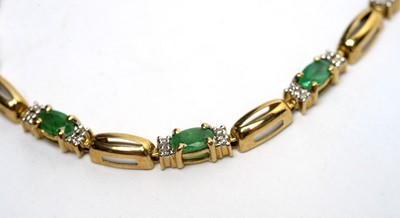 Lot 157 - A 9ct yellow gold, emerald and diamond bracelet