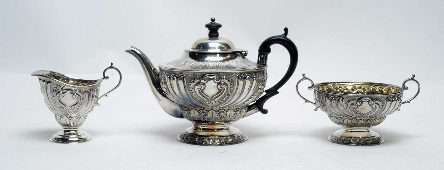 Lot 181 - A Victorian three piece silver tea service, by Edward Barnard & Sons Ltd