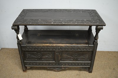 Lot 25 - A Victorian stained and carved oak monks bench.